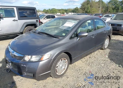 2010 Honda Civic Hybrid from USA, damaged, VIN JHMFA3F23AS003884